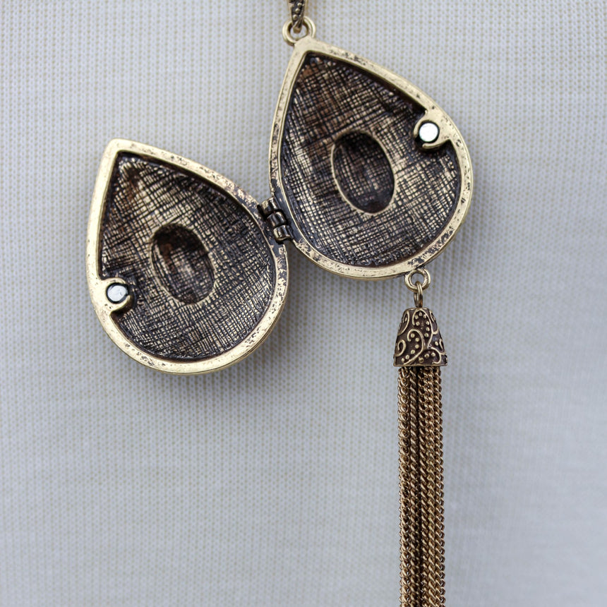 Teardrop Filigree Locket Necklace — Gold-Tone Alloy, Tassel, second angle of the open locket interior