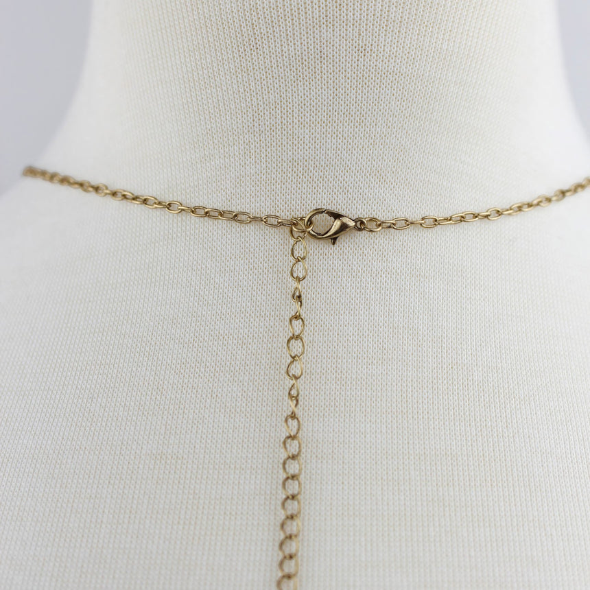 Teardrop Filigree Locket Necklace — Gold-Tone Alloy, Tassel, detail of the clasp and extender chain