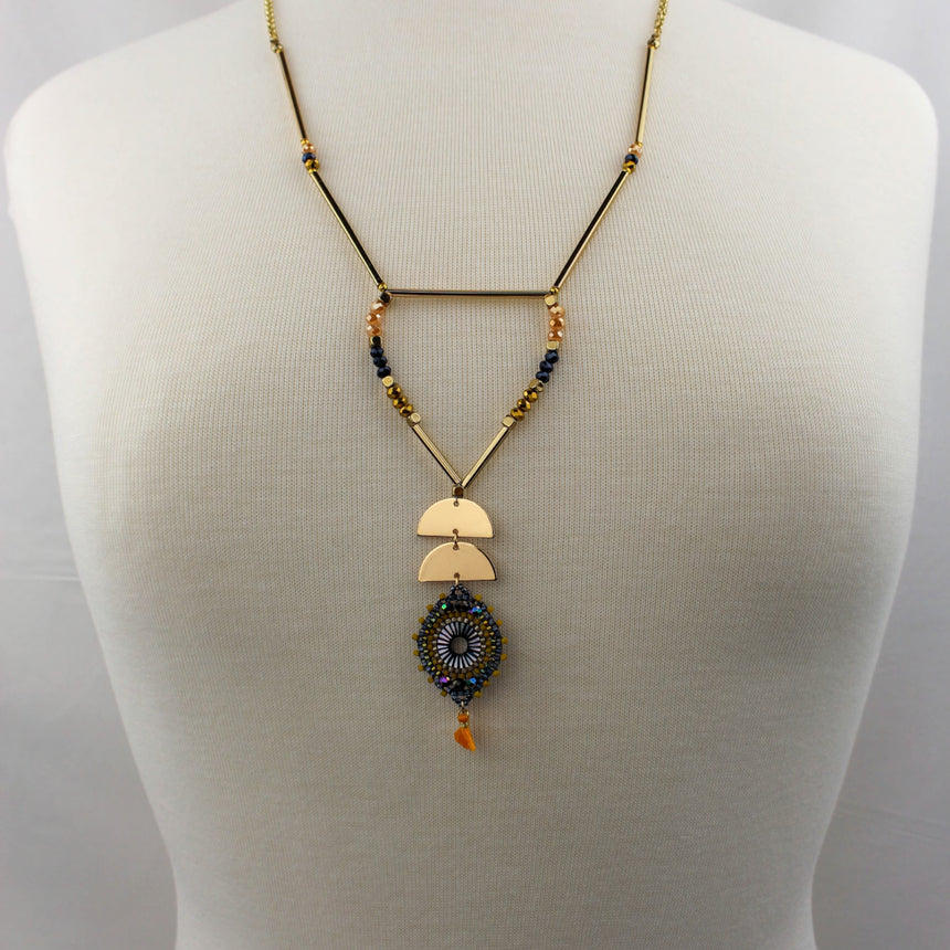 Half-Moon Medallion Necklace — Gold-Tone Alloy, Two Colors, Orange colorway, full necklace on mannequin
