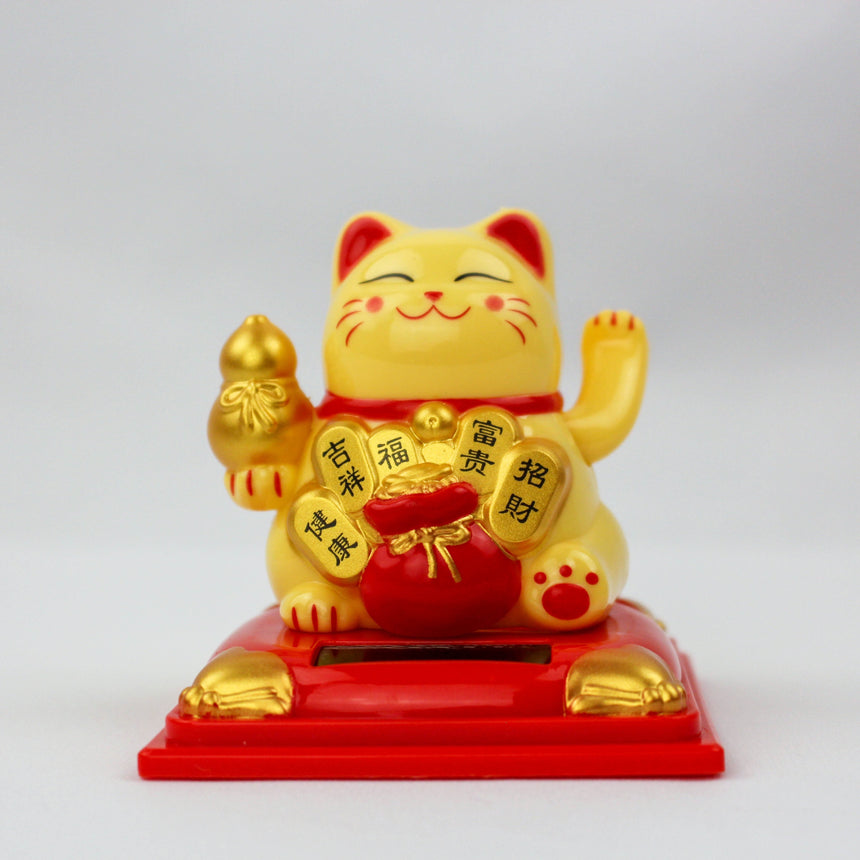 Solar Fortune Cat with Gourd and Money Bag, yellow front view with gourd, red bag, and kanji plaques on a red pedestal