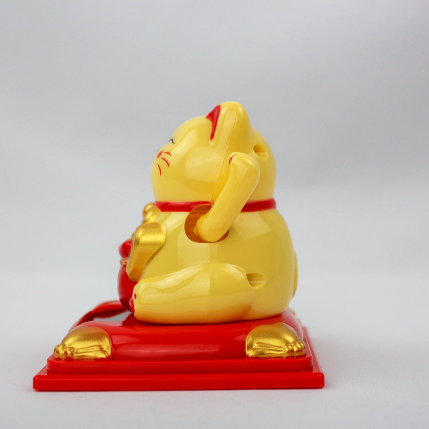 Solar Fortune Cat with Gourd and Money Bag, yellow side profile of the waving arm side, gold ingots on the pedestal corners