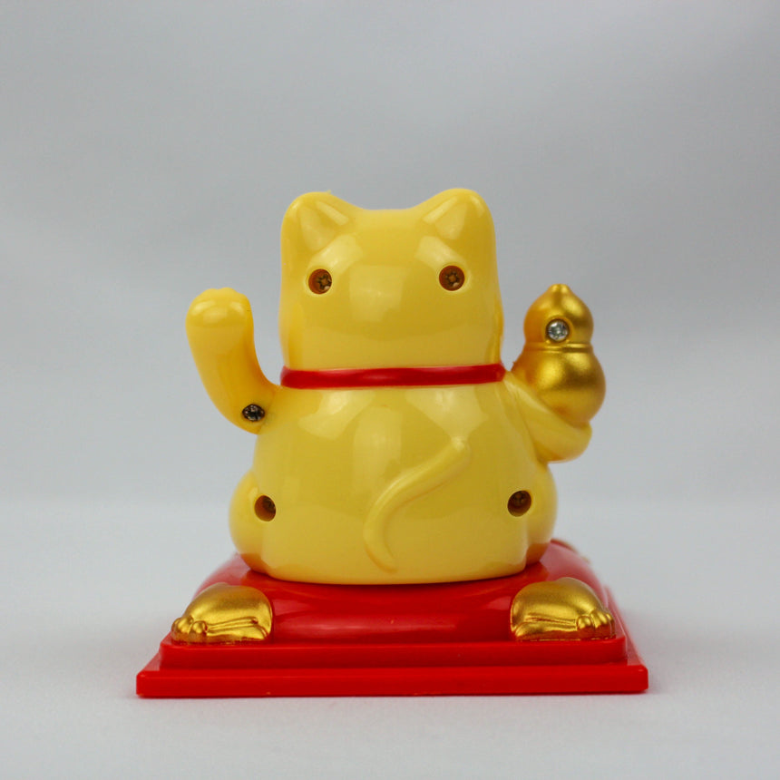 Solar Fortune Cat with Gourd and Money Bag, yellow back view showing curled tail and the gourd over its shoulder