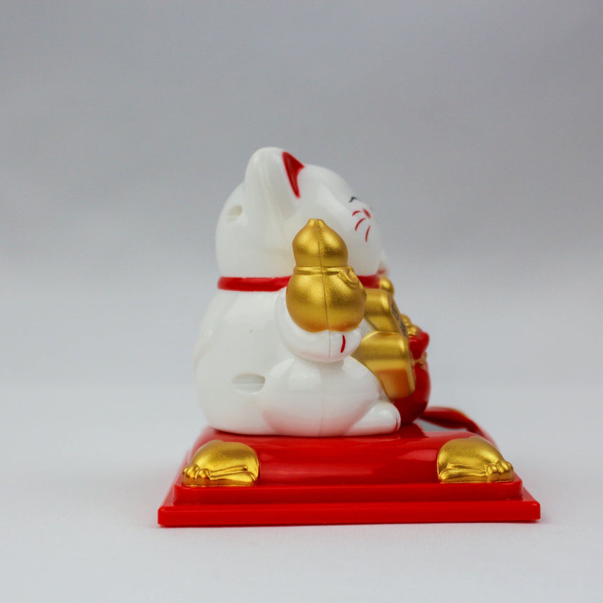 Solar Fortune Cat with Gourd and Money Bag, white rear three-quarter view showing gourd, red bag, and gold ingot trims