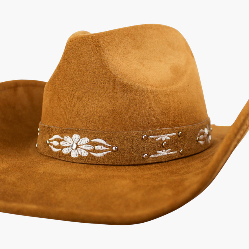 White-Floral Faux-Suede Western hat, Tan colorway in close-up showing the flower head and dome studs at macro scale
